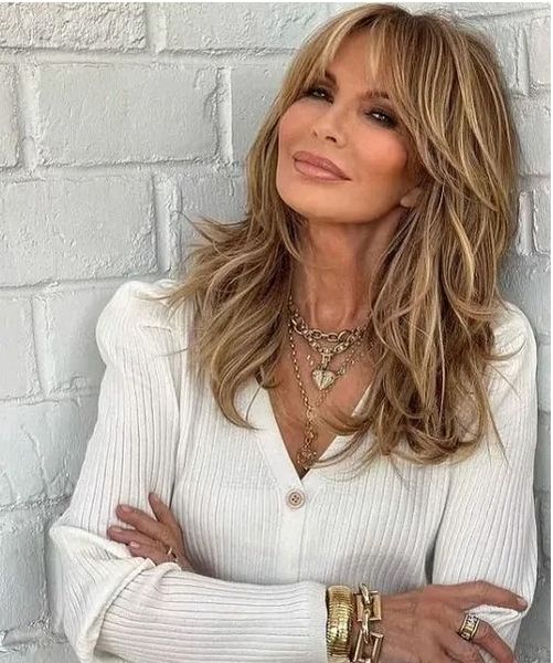 Veteran of Charlie’s Angels Jaclyn Smith, 77, poses in a winter white dress she created for Nordstrom Rack and appears as youthful as she did in her 20s