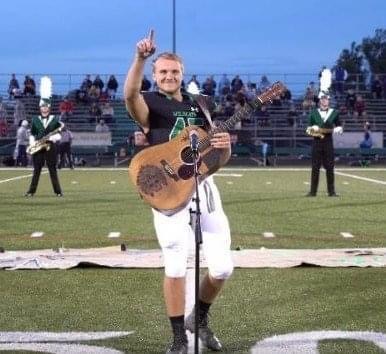 A high school boy grabbed a guitar and started singing the national anthem, since no one else wanted