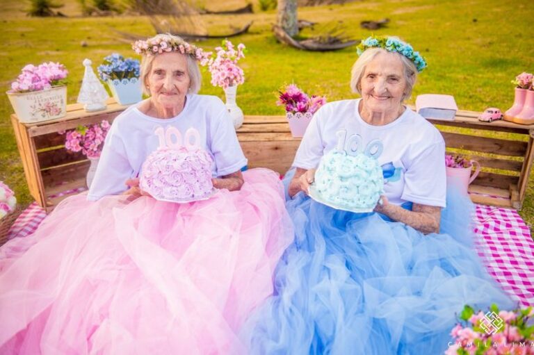 100 year old twins celebrate in style by wearing identical tutus to their party.