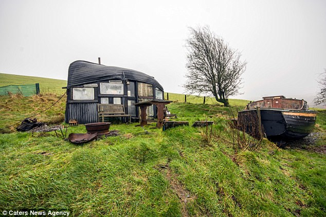 Old and Dusty Boat Converted into a Perfect Camping Illusion Under A Wooden Roof