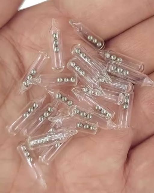 A package arrived for me containing small glass tubes with three tiny ball bearings inside